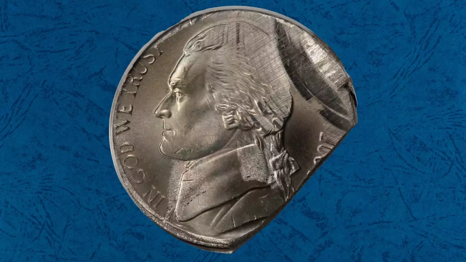 2004 nickel broadstrike error showing expanded coin diameter and flattened rim from missing collar during striking
