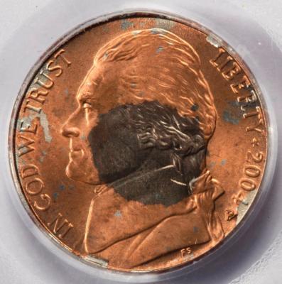 2004 nickel clipped planchet error showing missing curved section at the coin's edge